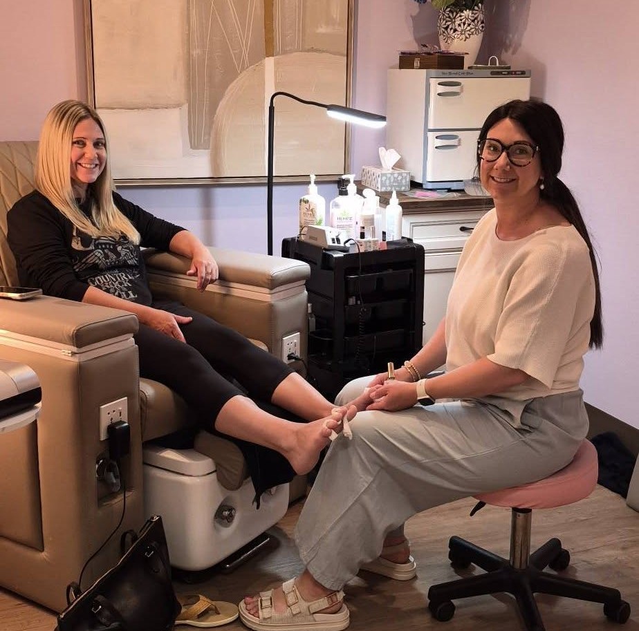 Steph Bradley giving a pedicure to a client in her treatment office at Wrobel Massage Therapy in Kingsville.